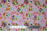 Flat swatch easter bunny fabric (baby pink fabric with small tossed orange carrots and pink floral heads, tossed easter bunny cartoon graphics and tossed birdhouses)