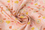Swirled swatch sophisticated spirits fabric (peach coloured fabric with tossed emblems allover orange and yellow drinks in fancy glasses, champagne bottles in pink, orange flowers, greenery, etc)
