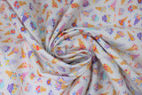 Swirled swatch ice cream blossoms fabric (white fabric with tiny tossed colourful ice cream cones and sundaes with floral in tan, red, purple, blue, yellow colourway)