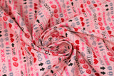 Swirled swatch I'd Pause My Video Game For You fabric (pink fabric with lines of video game related emblems: hearts, coins, x's, etc.)