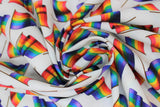 Swirled swatch pride flag toss fabric (white fabric with tossed waving rainbow flags with thin black poles)