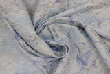 Swirled swatch ice blue/silver fabric (white and pale blue marbled look fabric with tossed blue, white, silver (sparkle) wispy greenery allover)
