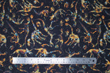 Flat swatch Dino Skeletons fabric (black fabric with multi-coloured dinosaur skeletons allover in various shapes and sizes)
