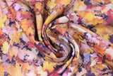 Swirled swatch autumn maple orange fabric (layered collage of realistic look orange/yellow maple leaves)