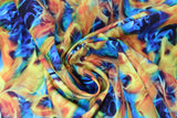 Swirled swatch colourful fire fabric (black fabric with realistic look flames allover in blue, orange, yellow, green)