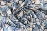 Swirled swatch pebbles blue fabric (layered collage realistic look stones/pebbles in various styles and shapes all with a blue/grey colourway)