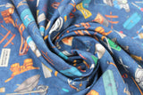 Swirled swatch Tossed Tools Blue fabric (deep blue coloured fabric with tossed illustrative style full colour tools: hammers, wrenches, paint brushes, tool boxes, etc.)