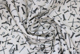 Swirled swatch Tossed Hardware White fabric (white fabric with tossed grey nuts, bolts, screws, etc.)