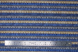 Flat swatch Rulers fabric (blue horizontal striped fabric with stripes, diagonal lines, etc. and natural and grey rulers alternating between patterns)