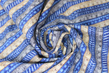 Swirled swatch Rulers fabric (blue horizontal striped fabric with stripes, diagonal lines, etc. and natural and grey rulers alternating between patterns)