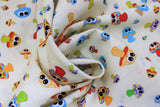 Swirled swatch Mushrooms fabric (white fabric with tossed colourful cartoon mushrooms with large eyes )