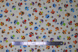 Flat swatch Mushrooms fabric (white fabric with tossed colourful cartoon mushrooms with large eyes )