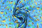 Swirled swatch Tadpoles fabric (medium blue fabric with tossed green large eyed tadpoles allover)