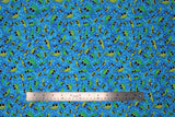 Flat swatch Tadpoles fabric (medium blue fabric with tossed green large eyed tadpoles allover)