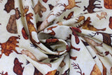 Swirled swatch Animal Toss fabric (white fabric with tossed brown animal silhouettes: deer, moose, bear, beaver, wolf, etc.)