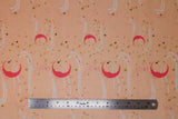 Flat swatch Stardust Moon fabric (peach coloured fabric with tossed pink crescent moons, star dots in pink and gold with sparkle effect, tossed tiny butterflies, white movement lines)