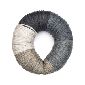 Caron Colorama round shaped yarn with label in colourway Salt and Pep (cream, charcoal, medium grey, grey, greige)