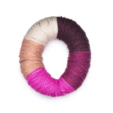 Caron Colorama round shaped yarn in colourway Lippy (palest blush pink, deep burgundy wine, muted fuchsia, bright fuchsia, peach)