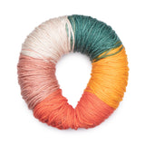 Caron Colorama round shaped yarn in colourway First Blush (cream, teal, mustard, bright orange, blush pink)