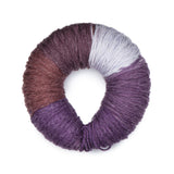 Caron Colorama round shaped yarn in colourway Concord Crush (burgundy purple, plum purple, pale purple, medium purple, deep purple)