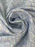 Swirled swatch microprint flannel in clouds (tiny white cloud shapes on light blue)