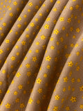 Swirled swatch microprint flannel in dainty flowers on brown (yellow tiny flower heads)