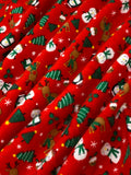 Swirled swatch winter themed flannel in Christmas buddies (tiny snowmen, rudolph, penguins and trees on red)