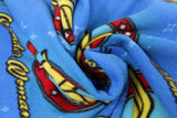Swirled swatch Wonder Woman licensed print on fleece (text, circular logo on blue)