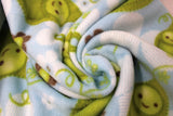 Swirled swatch FLC fleece print in Sweet Pea in Blue (white and brown flowers, happy pea pods on blue)