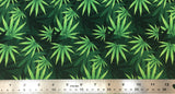 Flat swatch layered pot leaf print fabric on green