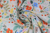 Swirled swatch Strawberry Fields collection floral printed fabric in white meadow (multi-coloured floral and strawberries on white)