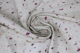 Swirled swatch floral printed fabric in Cordovan (white fabric with tiny pink and purple floral colour wisps tossed)