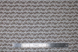 Flat swatch Leafy Gray fabric (white fabric with medium thick stripes of gray leaves making sideways v shapes)
