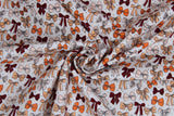Swirled swatch Ribbons and Bows fabric (white fabric with tossed illustrative style bows allover and dots in peach, orange, beige, maroon)