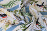 Swirled swatch forest themed fabric in Forest Life Stripe (birds, trees on white with blue stripes)