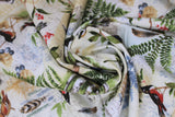 Swirled swatch forest themed fabric in Forest Notes (birds, plants, bugs vintage look collage on white)