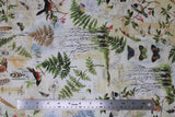 Flat swatch forest themed fabric in Forest Notes (birds, plants, bugs vintage look collage on white)