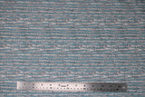 Flat swatch forest themed fabric in Birch Trees (longline white tree branches on pale blue)