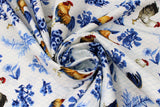 Swirled swatch Rooster Toss fabric (white fabric with tossed blue floral and greenery clusters allover and tossed full colour illustrative look roosters all with subtle blue honeycomb look pattern)