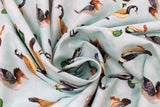 Swirled swatch Duck Duck Goose fabric (white fabric with tossed ducks and geese allover)
