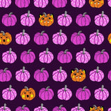 Square swatch Plum Shadow fabric (dark purple fabric with lines of purple pumpkins and occasional orange jack-o-lanterns)