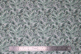 Flat swatch scales fabric (white fabric with dark grey, green, blue/green coloured scale texture allover)