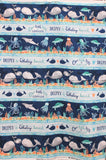 Full swatch whale themed fabric in Whaley Loved Panel 23"x44" (multi blue stripes, whales, and "whaley loved" text)