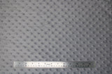 Flat swatch light grey solid coloured minky fabric with embossed dots