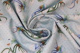 Swirled swatch Bicycle fabric (pale blue fabric with tossed old style blue bikes with brown baskets filled with blue and white floral with greenery and leaves)