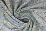 Swirled swatch Paisley fabric (green fabric with tossed deconstructed Paisley designs in white and blue)