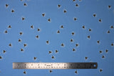 Flat swatch Fireflies fabric (light blue fabric with tossed fireflies allover)
