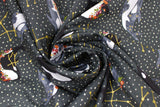 Swirled swatch Floral Whale fabric (dark grey fabric with white dots and gold constellations and tossed black and grey whales with floral decorations)