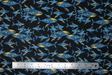 Flat swatch Midnight Whale fabric (deep navy fabric with tossed blue whales allover with stars and moons within)