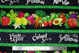 Flat swatch Orchard Selects fabric (black fabric with horizontal thick stripes with bright coloured illustrative fruits and veggies in some, white chalk look text "orchard selects" "locally grown" etc. text all separated by thin green stripes)